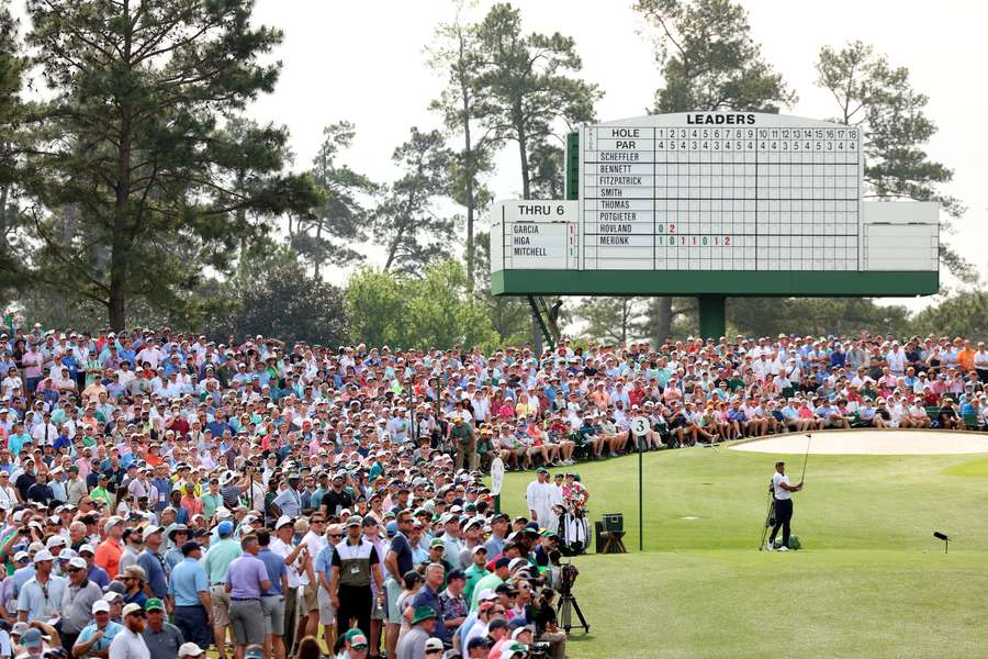 Tiger Woods plays his shot from the third tee