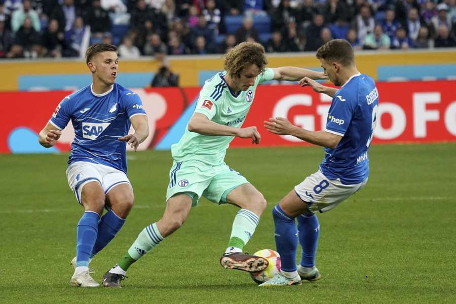 Schalke's Alex Kral, centre, scored an own goal in the game