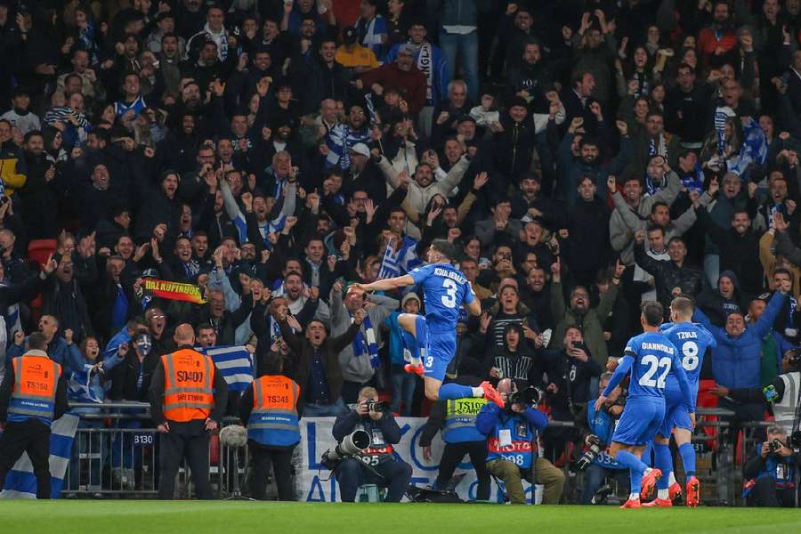 Greece celebrate their late winner