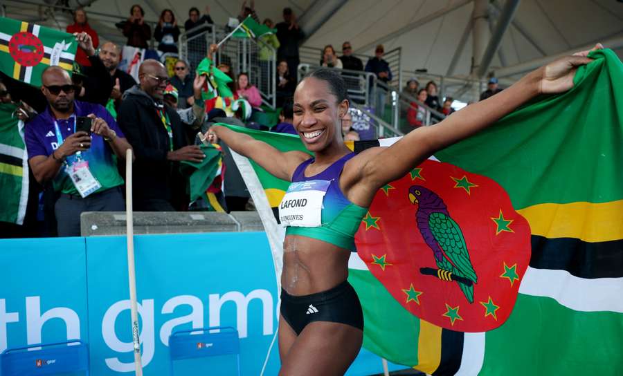 LaFond poses with the Dominica flag LaFond poses with the Dominica flag