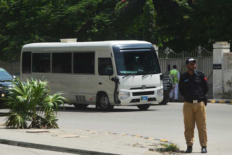 The England squad were guarded as they arrived in Karachi
