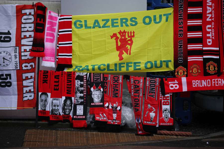 General view of Manchester United scarves and banners in protest against owners Jim Ratcliffe and the Glazer family