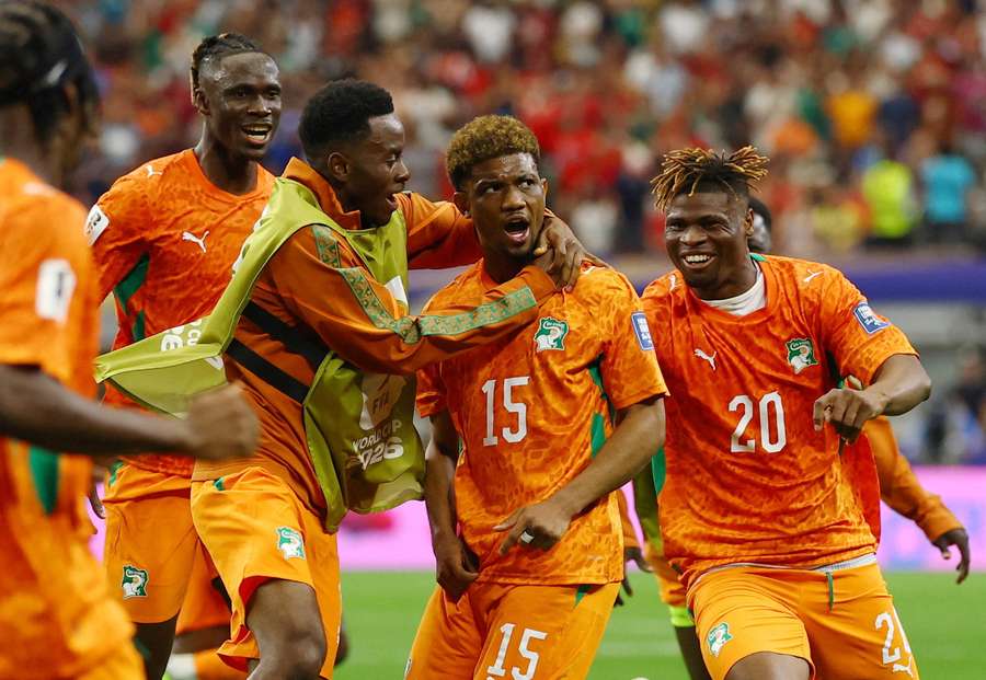 Ivory Coast's Amad Diallo celebrates scoring with teammates