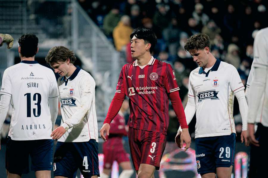 FC Midtjylland's Han-Beom Lee surround by AGF-players in the first leg of their clash in the Danish cup semi-final