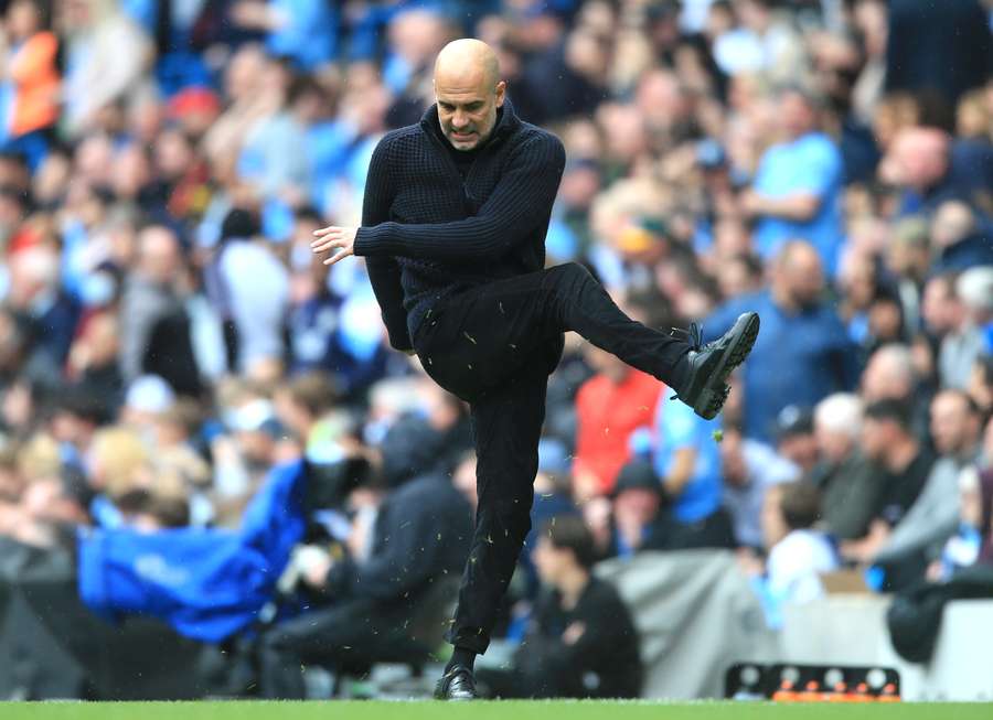 Manchester City's Spanish manager Pep Guardiola reacts during the English Premier League football match between Manchester City and Leeds United