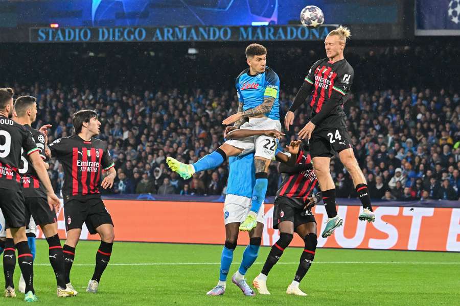 Napoli defender Giovanni Di Lorenzo and AC Milan's Simon Kjaer go for a header Napoli defender Giovanni Di Lorenzo and AC Milan's Simon Kjaer go for a header