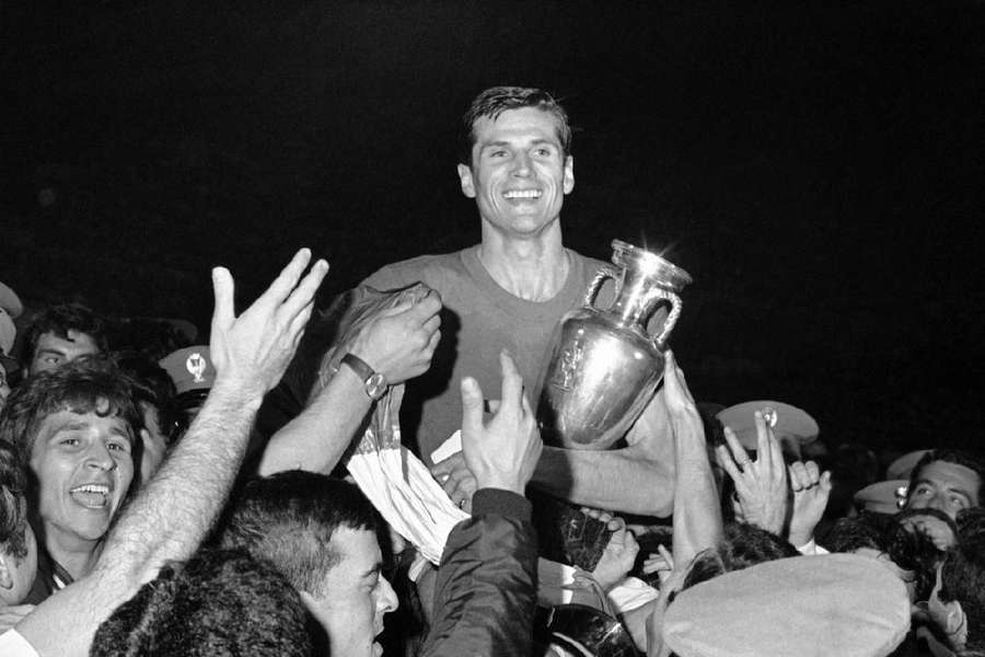 Italy captain Giacinto Facchetti with the trophy awarded to the champions