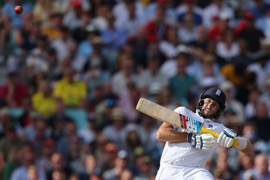 England's Joe Root hits a boundary on day three