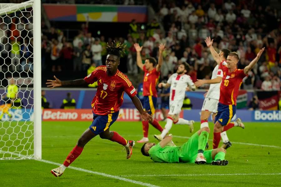 Spain's Nico Williams, left, celebrates after scoring his side's third goal