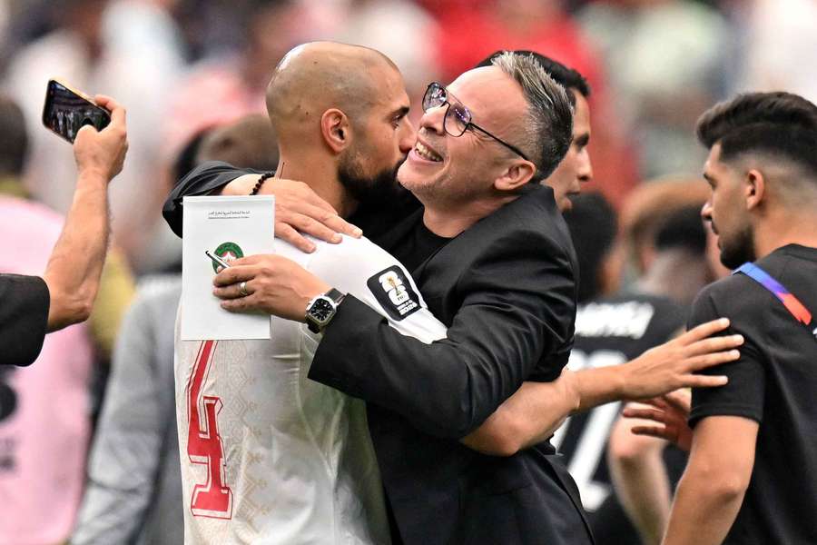 Morocco's Sofyan Amrabat and coach Mohamed Ouahbi celebrate after the match Morocco's Sofyan Amrabat and coach Mohamed Ouahbi celebrate after the match