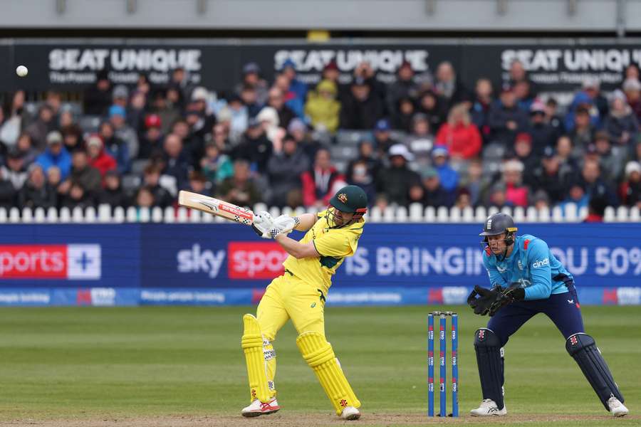 Australia's Travis Head hits a six as England's Jamie Smith keeps wicket