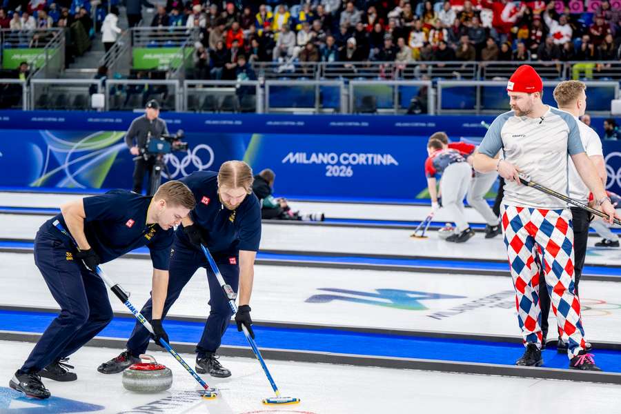 Oskar Eriksson and Rasmus Wrana sweeping for Sweden