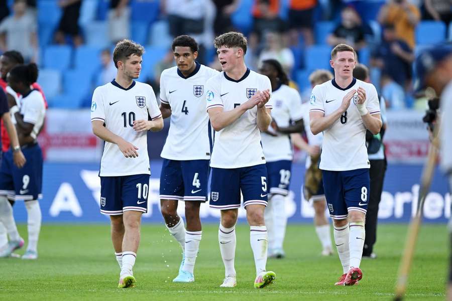 Charlie Cresswell, centre, applauds England's fans alongside his teammates after their semi-final win