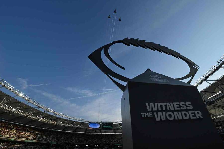 Hungarian Air Force jets fly over the stadium during the opening ceremony