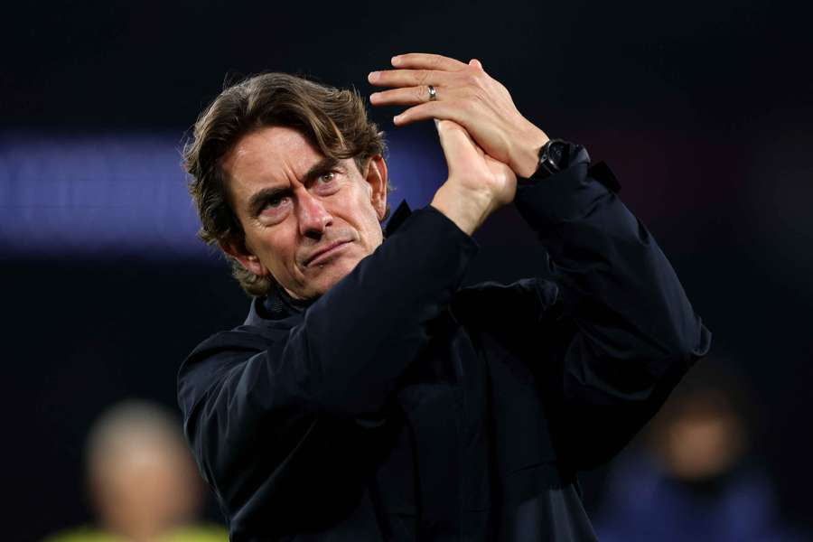 Thomas Frank applauds the fans after Tottenham's defeat to PSG in the Champions League.