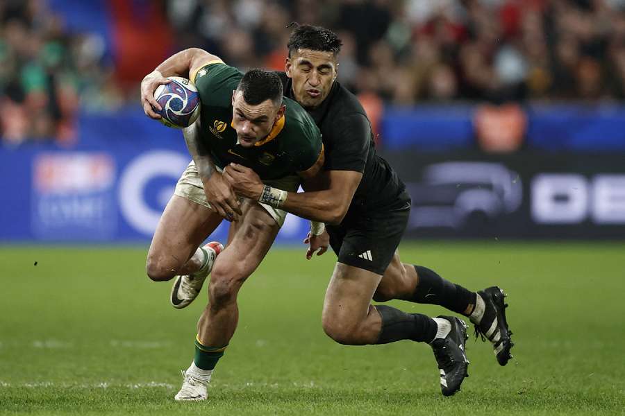 South Africa's Jesse Kriel in action with New Zealand's Rieko Ioane
