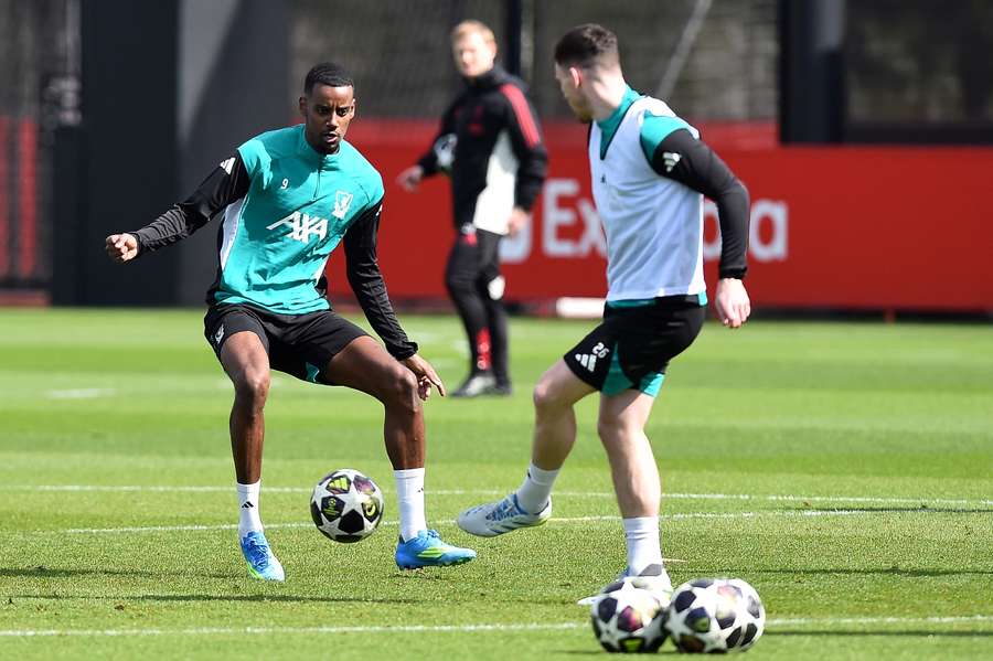 Liverpool striker Alexander Isak (L) trains ahead of the Champions League clash with Paris Saint-Germain