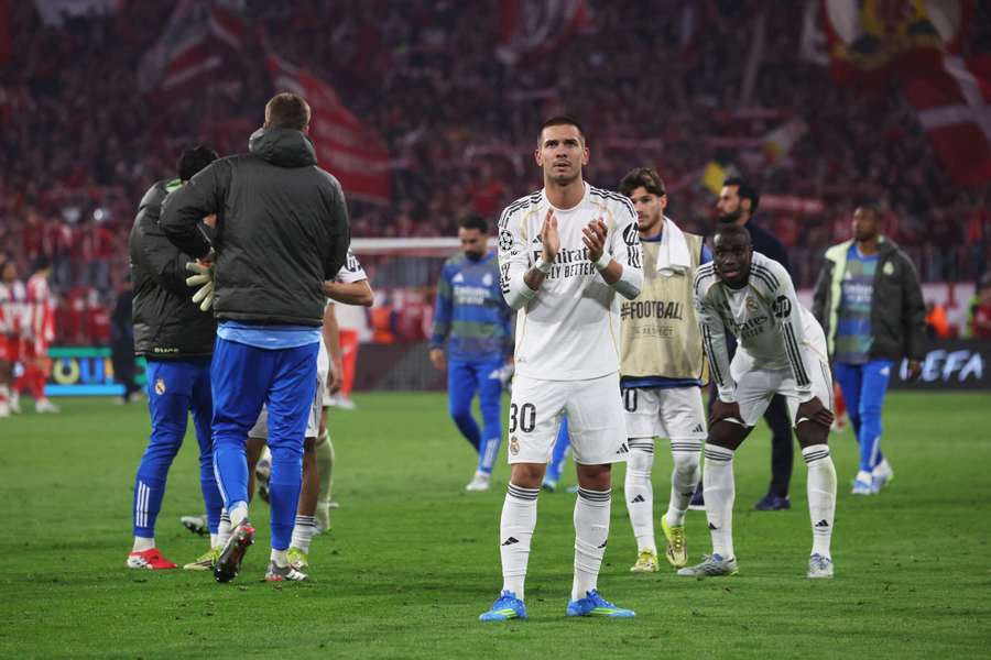 Real Madrid players applaud the fans after their Champions League elimination against Bayern Munich.