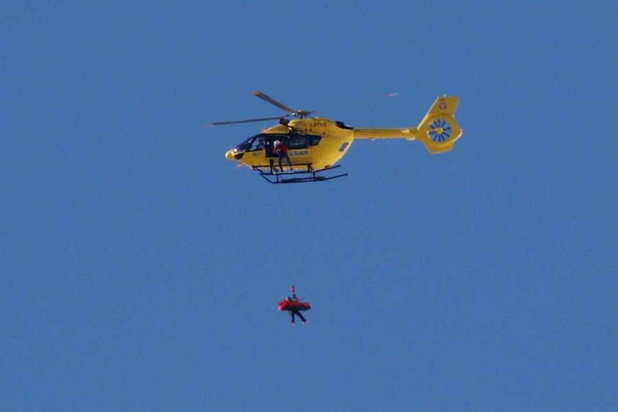 A helicopter carries Lindsey Vonn
