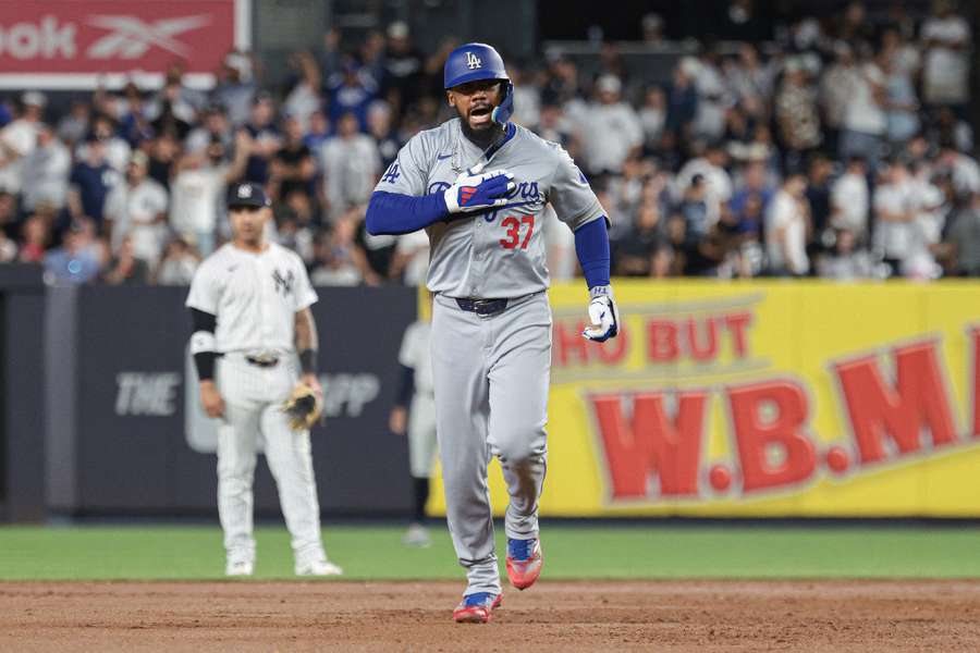 Los Angeles Dodgers right fielder Teoscar Hernandez celebrates while running the bases after his grand slam home run