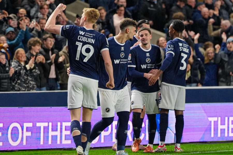 Josh Coburn of Millwall celebrates with the crowd following his opening goal