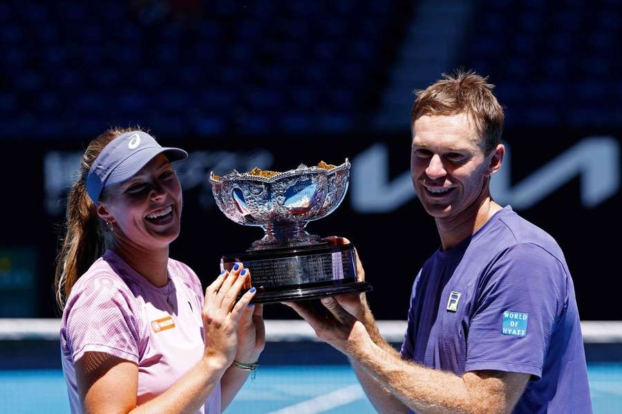 Australia's Olivia Gadecki and John Peers pose with the trophy after winning the mixed doubles final