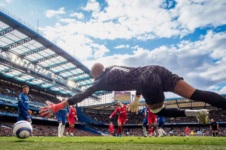 Liverpool's Virgil van Dijk of Liverpool scores past Chelsea's Robert Sanchez at Stamford Bridge in May 2025