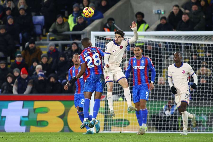 Crystal Palace's Cheick Doucoure and Chelsea's Pedro Neto fight for the ball