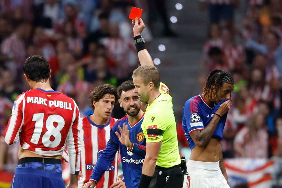 Swedish referee Glenn Nyberg shows a red card to Man Utd's Leny Yoro Swedish referee Glenn Nyberg shows a red card to Man Utd's Leny Yoro