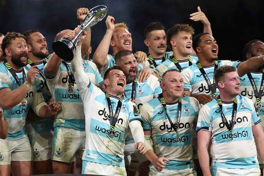 Bath's Ben Spencer holds the trophy as he and teammates celebrate winning the Challenge Cup final
