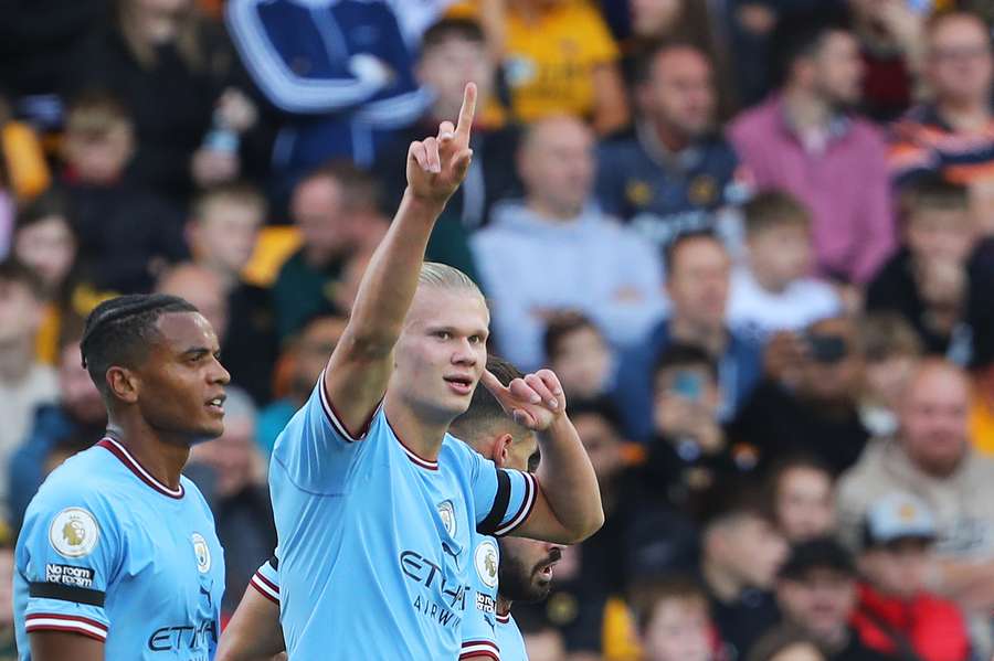 Manchester City striker Erling Haaland celebrates scoring his team's record-breaking goal against Wolves.