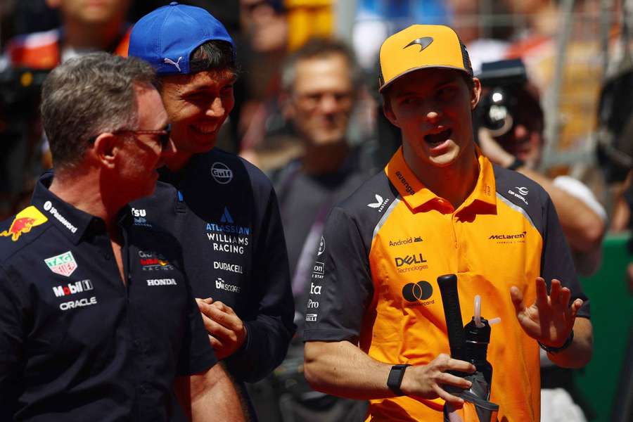 Christian Horner, left, alongside Alex Albon and Oscar Piastri in Shanghai