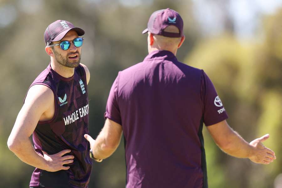 England's Mark Wood (L) bowled in the nets ahead of the first Test against Australia