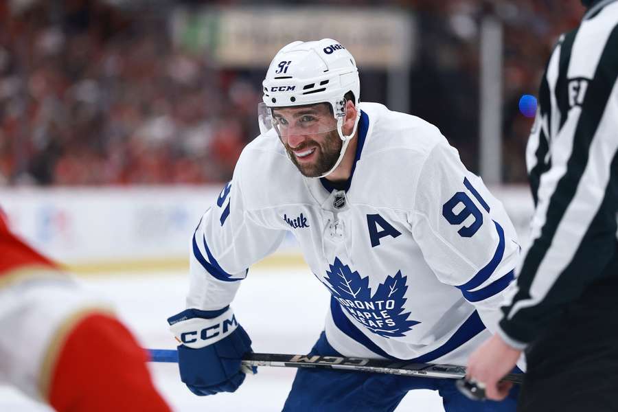 John Tavares smiling before a face-off during the 2025 Stanley Cup Playoffs against the Florida Panthers