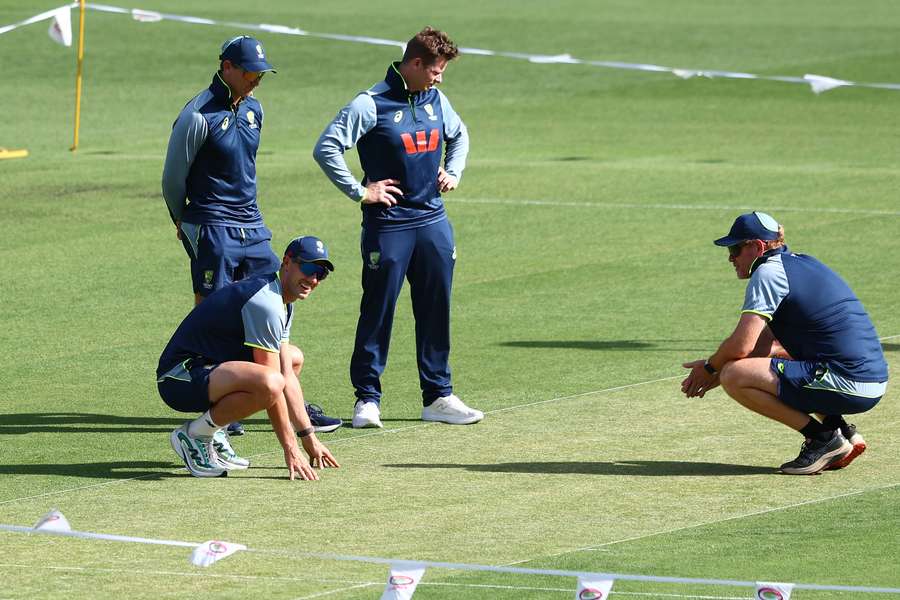 Pat Cummins inspects the Gabba pitch with Steve Smith and Andrew McDonald on Wednesday.