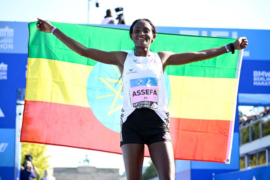 Ethiopia's Tigist Assefa celebrates after smashing the women's marathon world record in Berlin