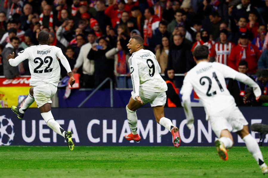Kylian Mbappe, centre, and Antonio Rudiger celebrate their penalty shootout win over Atletico Madrid