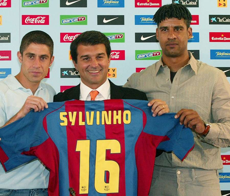 Frank Rijkaard and Joan Laporta presenting Sylvinho as a new signing.
