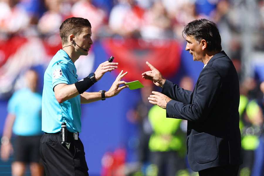 Croatia coach Zlatko Dalic reacts with referee Francois Letexier 