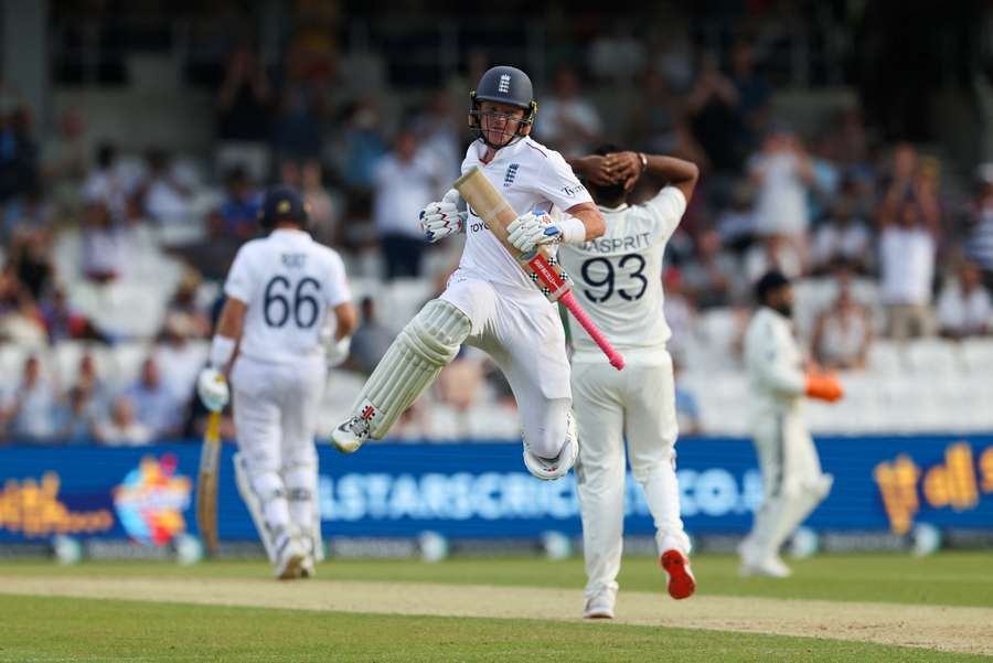 Ollie Pope celebrates after reaching his century against India on day two