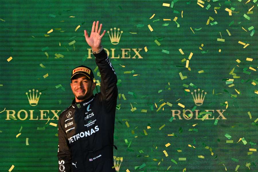 Second-placed Mercedes' British driver Lewis Hamilton celebrates on the podium