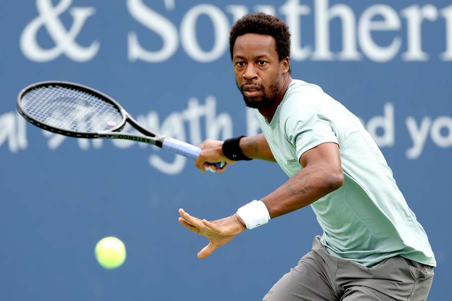 Gael Monfils returns a shot to Cameron Norrie