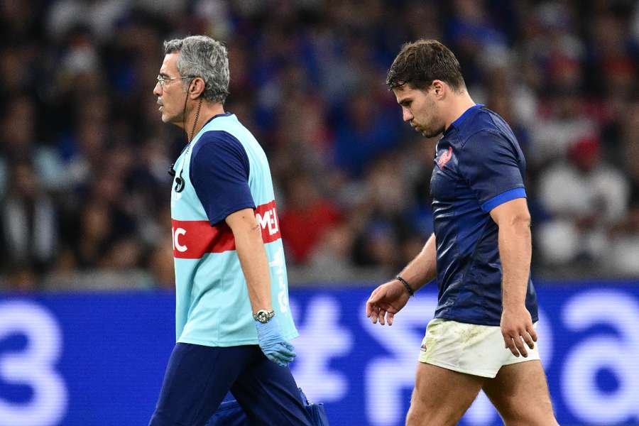 Antoine Dupont leaves the field after a clash of heads with Namibia captain Johan Deysel