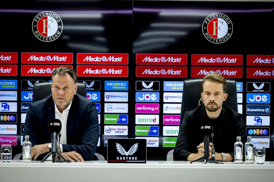 Feyenoord technical director Devy Rigaux (R) speaks at a press conference along with general manager Robert Eenhoorn