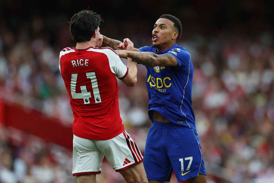 Arsenal's Declan Rice clashes with Chelsea's Morgan Rogers