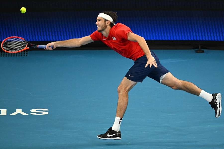 Fritz returns against Hurkacz during the men's singles semi-final