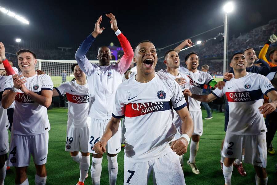 Kylian Mbappe celebrates with the fans