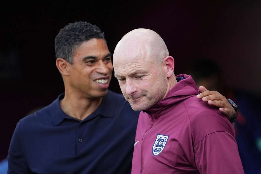Netherlands manager Michael Reiziger meets England boss Lee Carsley prior to kick-off