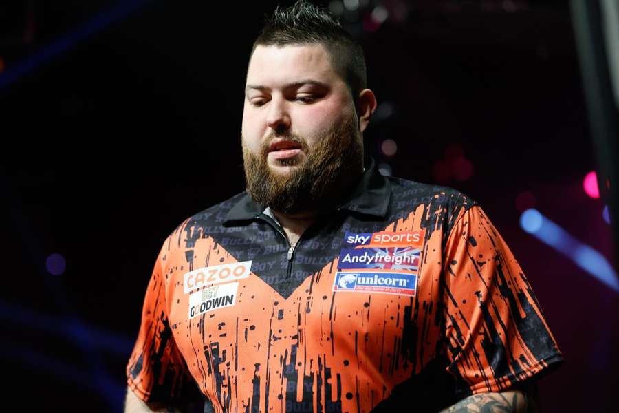 Michael Smith starts Friday night defending his title