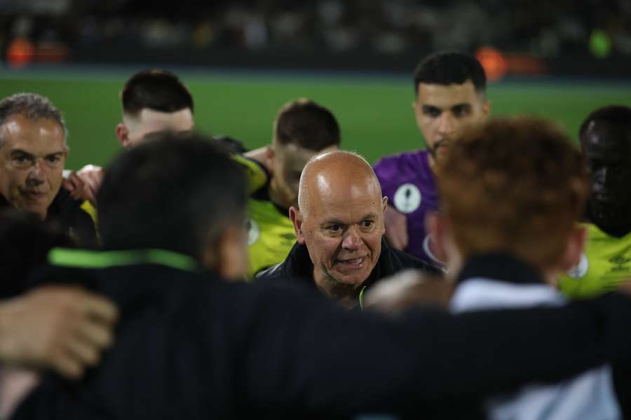 Heidelberg United head coach John Anastasiadis revs up his players during the Australia Cup final.